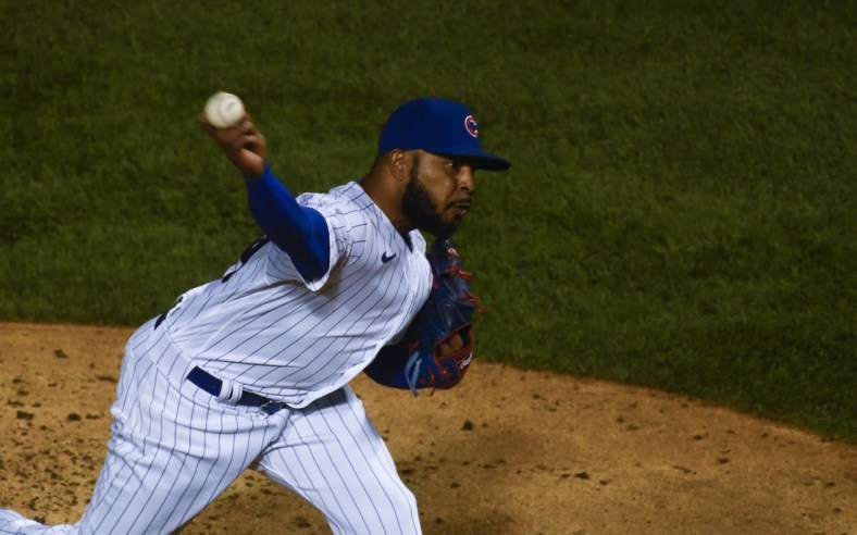 Sep 8, 2020; Chicago, Illinois, USA;  Chicago Cubs relief pitcher Jeremy Jeffress (24) delivers in the ninth inning against the Cincinnati Reds at Wrigley Field. Mandatory Credit: Matt Marton-USA TODAY Sports