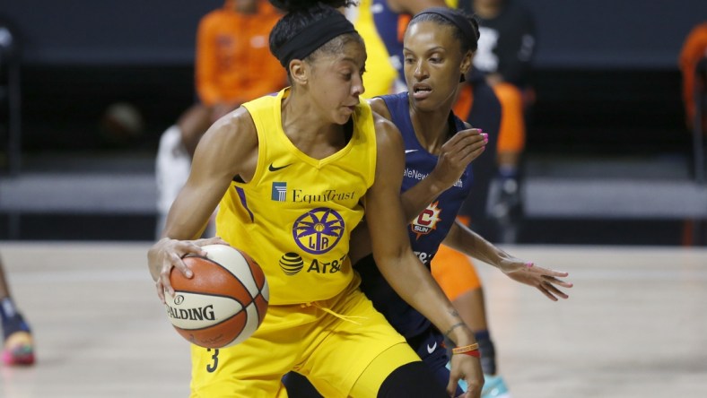 Sep 17, 2020; Palmetto, Florida, USA;  Los Angeles Sparks forward Candace Parker (3) drives past Connecticut Sun forward DeWanna Bonner (24) during the first half at the FELD entertainment complex. Mandatory Credit: Reinhold Matay-USA TODAY Sports