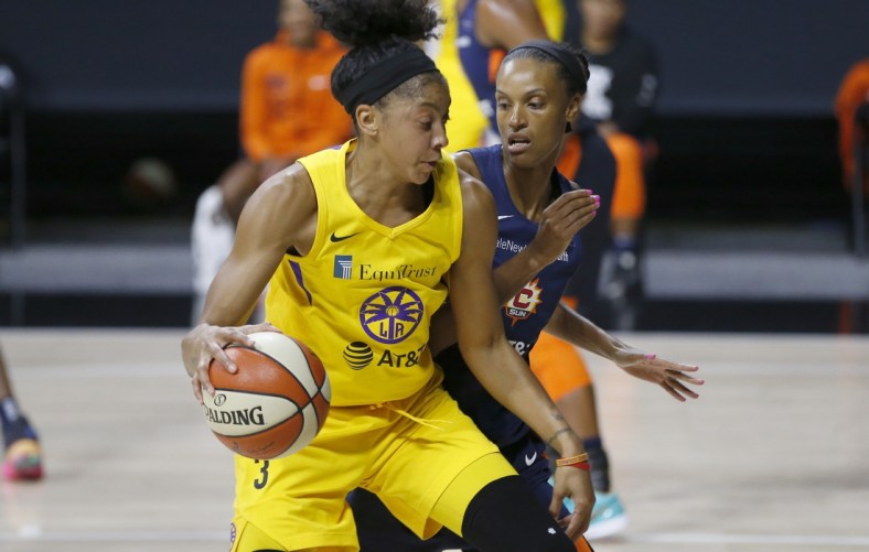 Sep 17, 2020; Palmetto, Florida, USA;  Los Angeles Sparks forward Candace Parker (3) drives past Connecticut Sun forward DeWanna Bonner (24) during the first half at the FELD entertainment complex. Mandatory Credit: Reinhold Matay-USA TODAY Sports