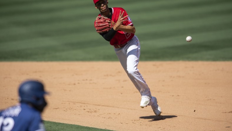 Sep 20, 2020; Anaheim, California, USA; Los Angeles Angels shortstop Andrelton Simmons (2) throws the baseball against the Texas Rangers during the game at Angel Stadium. Mandatory Credit: Angels Baseball/Pool Photo via USA TODAY Network