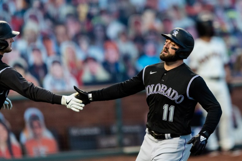 Sep 21, 2020; San Francisco, California, USA; Colorado Rockies center fielder Kevin Pillar (11) celebrates after scoring a run against the San Francisco Giants  in the first inning at Oracle Park. Mandatory Credit: John Hefti-USA TODAY Sports