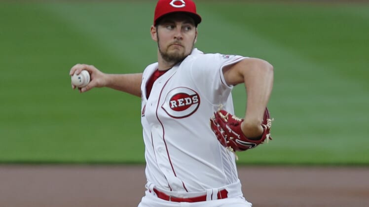 Sep 23, 2020; Cincinnati, Ohio, USA; Cincinnati Reds starting pitcher Trevor Bauer (27) throws against the Milwaukee Brewers during the first inning at Great American Ball Park. Mandatory Credit: David Kohl-USA TODAY Sports