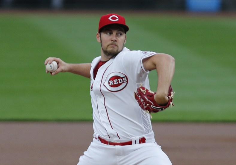 Sep 23, 2020; Cincinnati, Ohio, USA; Cincinnati Reds starting pitcher Trevor Bauer (27) throws against the Milwaukee Brewers during the first inning at Great American Ball Park. Mandatory Credit: David Kohl-USA TODAY Sports