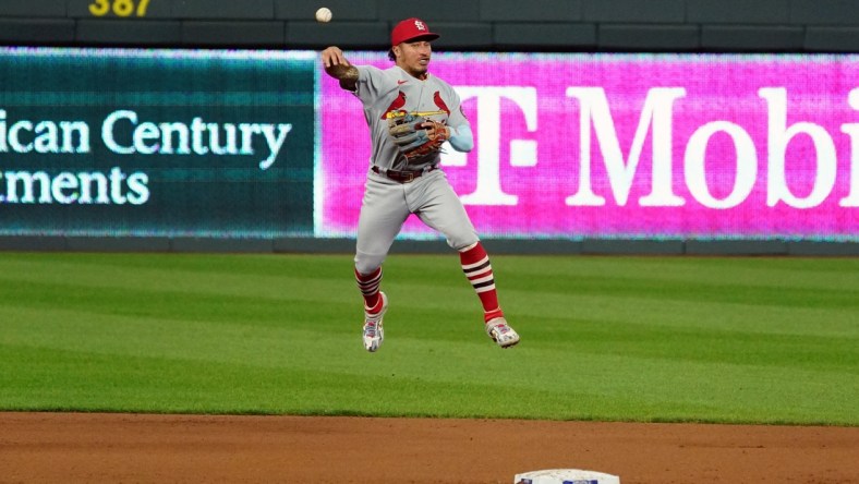 Sep 23, 2020; Kansas City, Missouri, USA; St. Louis Cardinals second baseman Kolten Wong (16) makes a leaping throw to first base for the out against the Kansas City Royals in the fourth inning at Kauffman Stadium. Mandatory Credit: Denny Medley-USA TODAY Sports