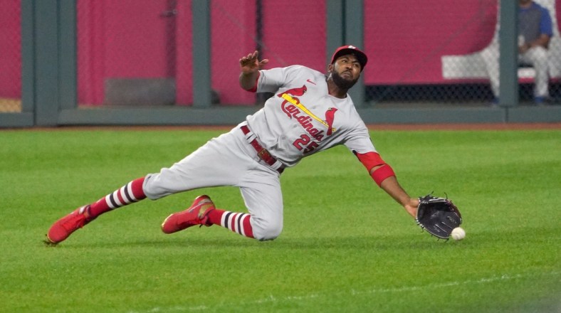 Sep 23, 2020; Kansas City, Missouri, USA; St. Louis Cardinals right fielder Dexter Fowler (25) misses a pop fly in the fifth inning against the Kansas City Royals at Kauffman Stadium. Mandatory Credit: Denny Medley-USA TODAY Sports