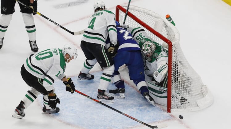 Sep 26, 2020; Edmonton, Alberta, CAN; Tampa Bay Lightning center Brayden Point (21) is shoved into the net of Dallas Stars goaltender Anton Khudobin (35) during overtime in game five of the 2020 Stanley Cup Final at Rogers Place. Mandatory Credit: Perry Nelson-USA TODAY Sports