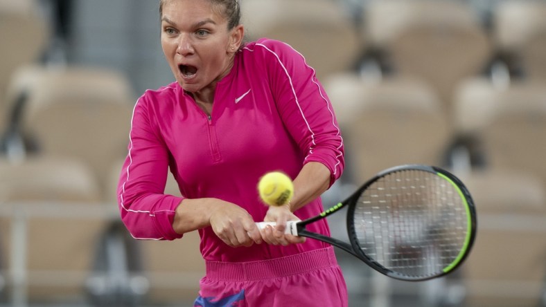 Oct 4, 2020; Paris, France; Simona Halep (ROU) in action during her match against Iga Swiatek (POL) on day eight at Stade Roland Garros. Mandatory Credit: Susan Mullane-USA TODAY Sports