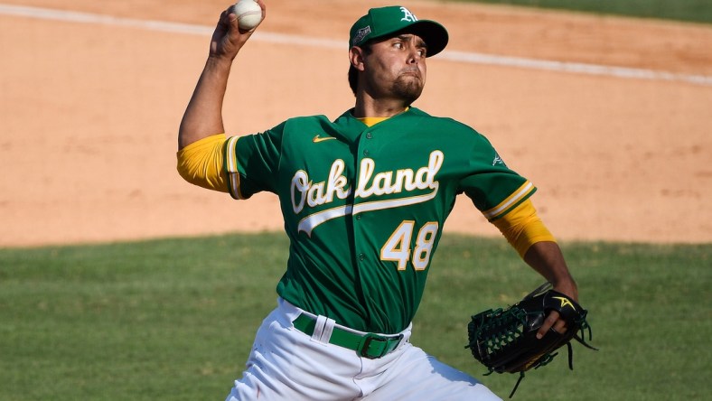 Oct 6, 2020; Los Angeles, California, USA; Oakland Athletics relief pitcher Joakim Soria (48) pitches against the Houston Astros during the eighth inning in game two of the 2020 ALDS at Dodger Stadium. Mandatory Credit: Robert Hanashiro-USA TODAY Sports