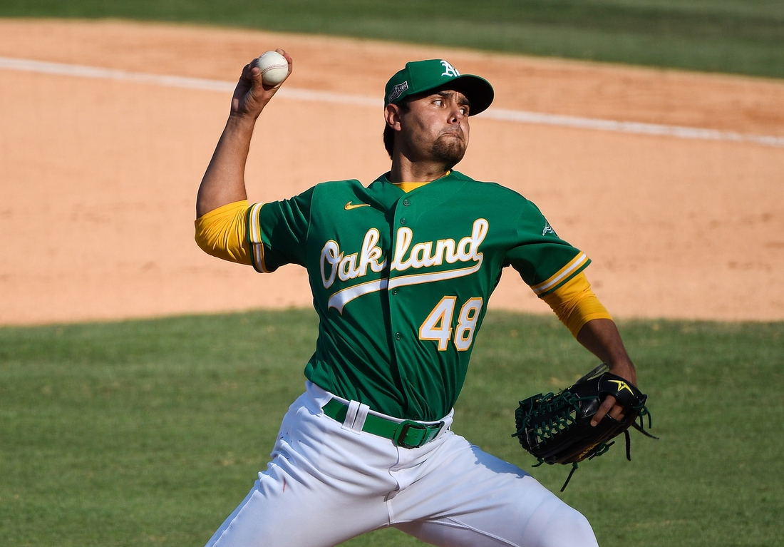 Oct 6, 2020; Los Angeles, California, USA; Oakland Athletics relief pitcher Joakim Soria (48) pitches against the Houston Astros during the eighth inning in game two of the 2020 ALDS at Dodger Stadium. Mandatory Credit: Robert Hanashiro-USA TODAY Sports