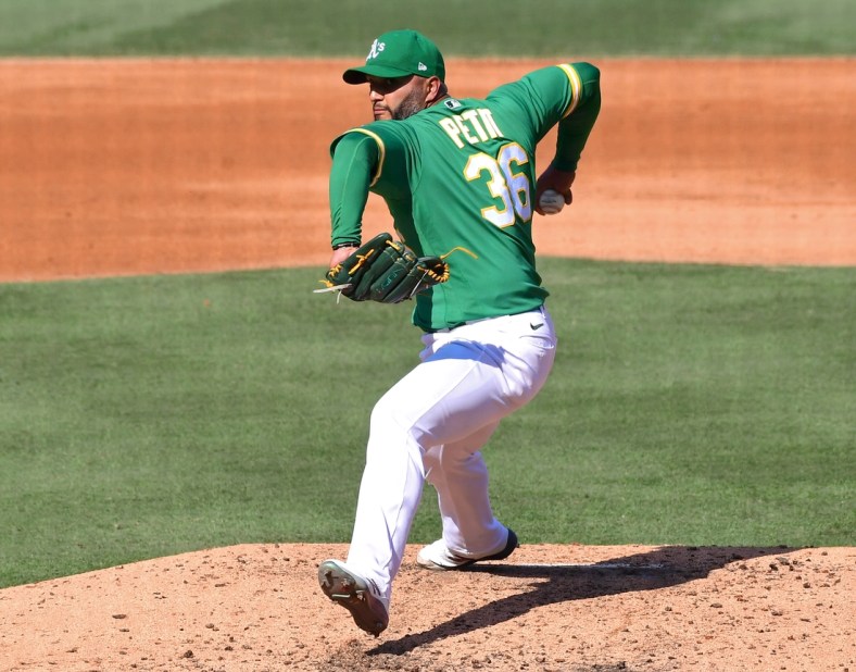 Oct 6, 2020; Los Angeles, California, USA; Oakland Athletics relief pitcher Yusmeiro Petit (36) in the sixth inning of game two of the 2020 ALDS against the Houston Astros at Dodger Stadium. Mandatory Credit: Jayne Kamin-Oncea-USA TODAY Sports