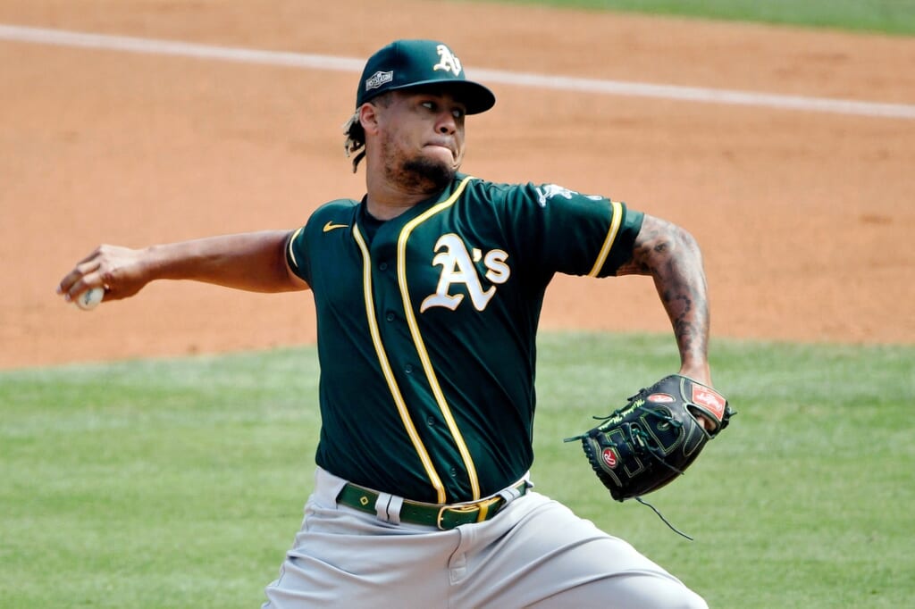 Oct 8, 2020; Los Angeles, California, USA; Oakland Athletics starting pitcher Frankie Montas (47) pitches against the Houston Astros during the first inning during game four of the 2020 ALDS at Dodger Stadium. Mandatory Credit: Robert Hanashiro-USA TODAY Sports