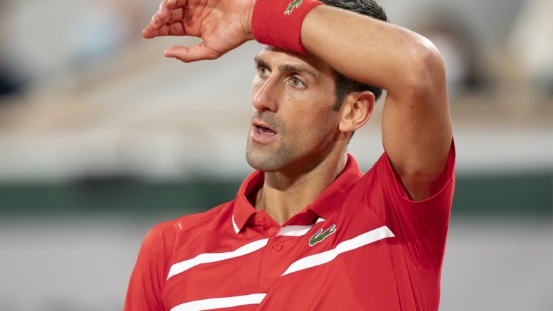 Oct 11, 2020;  Paris, France; Novak Djokovic (SRB) reacts during his match against Rafael Nadal (ESP) on day 15 at Stade Roland Garros. Mandatory Credit: Susan Mullane-USA TODAY Sports