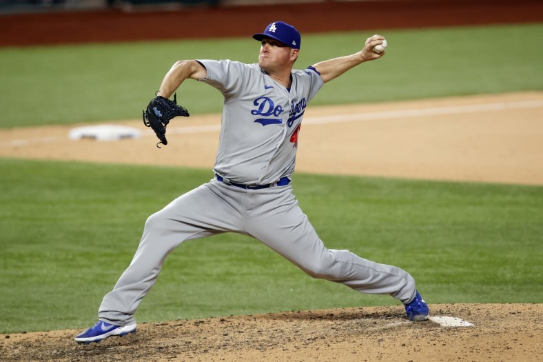 Oct 15, 2020; Arlington, Texas, USA; Los Angeles Dodgers relief pitcher Jake McGee (41) throws against the Atlanta Braves during the eighth inning of game four of the 2020 NLCS at Globe Life Field. Mandatory Credit: Tim Heitman-USA TODAY Sports