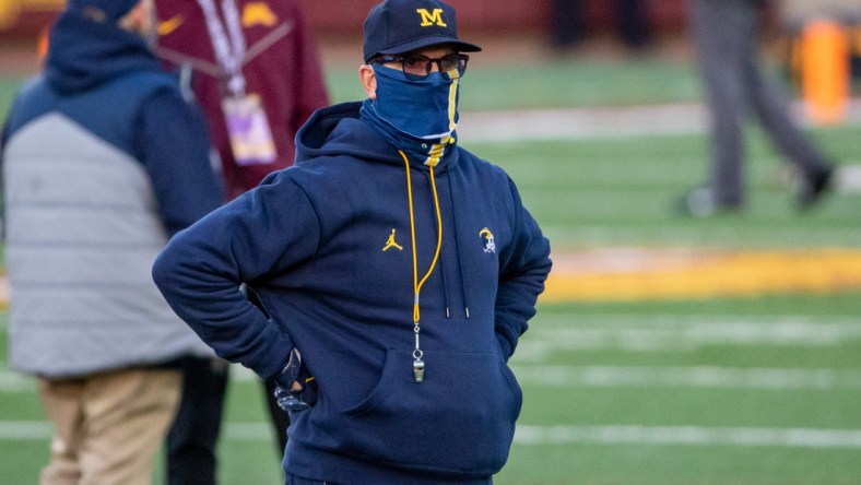 Oct 24, 2020; Minneapolis, Minnesota, USA; Michigan Wolverines head coach Jim Harbaugh looks on during pre game warmups before a game against the Minnesota Golden Gophers at TCF Bank Stadium. Mandatory Credit: Jesse Johnson-USA TODAY Sports