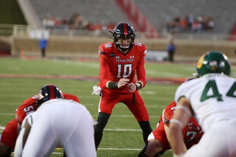 Nov 14, 2020; Lubbock, Texas, USA;  Texas Tech Red Raiders quarterback Alan Bowman (10) calls signals in the second half in the game against the Baylor Bears at Jones AT&T Stadium. Mandatory Credit: Michael C. Johnson-USA TODAY Sports