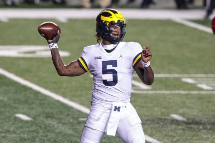 Nov 21, 2020; Piscataway, New Jersey, USA; Michigan Wolverines quarterback Joe Milton (5) throws the ball against the Rutgers Scarlet Knights during the first half at SHI Stadium. Mandatory Credit: Vincent Carchietta-USA TODAY Sports
