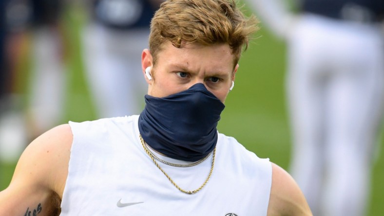 Nov 21, 2020; University Park, Pennsylvania, USA; Penn State Nittany Lions quarterback Will Levis (7) warms up while wearing a mask prior to the game against the Iowa Hawkeyes at Beaver Stadium. Mandatory Credit: Rich Barnes-USA TODAY Sports