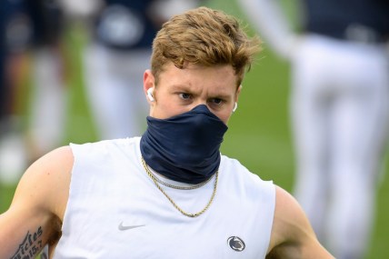 Nov 21, 2020; University Park, Pennsylvania, USA; Penn State Nittany Lions quarterback Will Levis (7) warms up while wearing a mask prior to the game against the Iowa Hawkeyes at Beaver Stadium. Mandatory Credit: Rich Barnes-USA TODAY Sports
