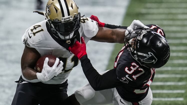 Dec 6, 2020; Atlanta, Georgia, USA; New Orleans Saints running back Alvin Kamara (41) battles with Atlanta Falcons safety Ricardo Allen (37) while running with the ball during the first half at Mercedes-Benz Stadium. Mandatory Credit: Dale Zanine-USA TODAY Sports