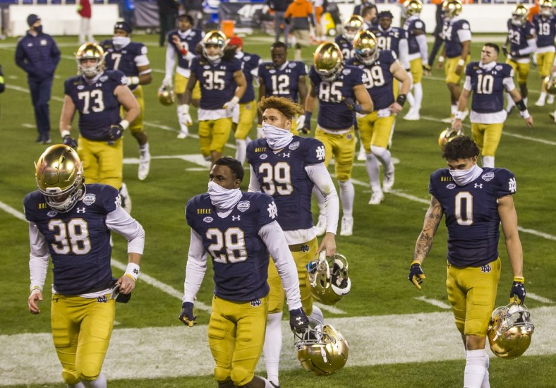Dec. 19, 2020; Charlotte, NC, USA; Notre Dame players head to the locker room following the ACC Championship football game on Saturday, Dec. 19, 2020, inside Bank of America Stadium in Charlotte, NC. Clemson won 34-10. Mandatory Credit: Robert Franklin/South Bend Tribune via USA TODAY NETWORK