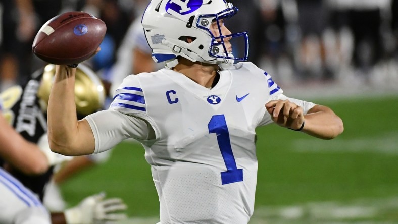 Dec 22, 2020; Boca Raton, Florida, USA; Brigham Young Cougars quarterback Zach Wilson (1) attempts a pass against the UCF Knights during the first half at FAU Stadium. Mandatory Credit: Jasen Vinlove-USA TODAY Sports