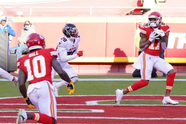 Dec 27, 2020; Kansas City, MO, USA; Kansas City Chiefs wide receiver Demarcus Robinson (11) catches a pass for a touchdown against Atlanta Falcons defensive back Kendall Sheffield (20) in the fourth quarter of a NFL game at Arrowhead Stadium. Mandatory Credit: Denny Medley-USA TODAY Sports