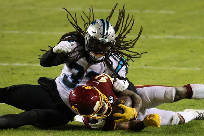 Dec 27, 2020; Landover, Maryland, USA; Washington Football Team running back J.D. McKissic (41) is tackled by Carolina Panthers free safety Tre Boston (33) in the fourth quarter at FedExField. Mandatory Credit: Geoff Burke-USA TODAY Sports