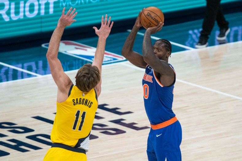 Jan 2, 2021; Indianapolis, Indiana, USA; New York Knicks forward Julius Randle (30) shoots the ball while Indiana Pacers forward Domantas Sabonis (11) defends in the fourth quarter at Bankers Life Fieldhouse. Mandatory Credit: Trevor Ruszkowski-USA TODAY Sports