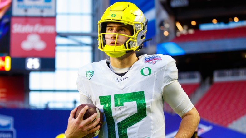 Jan 2, 2021; Glendale, AZ, USA; Oregon Ducks quarterback Tyler Shough (12) against the Iowa State Cyclones in the Fiesta Bowl at State Farm Stadium. Mandatory Credit: Mark J. Rebilas-USA TODAY Sports