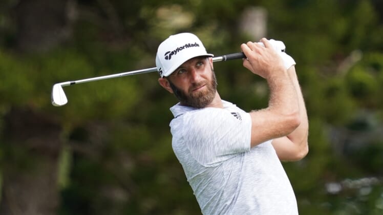 January 7, 2021; Maui, Hawaii, USA; Dustin Johnson hits a tee shot on the second hole during the first round of the Sentry Tournament of Champions golf tournament at Kapalua Resort - The Plantation Course. Mandatory Credit: Kyle Terada-USA TODAY Sports