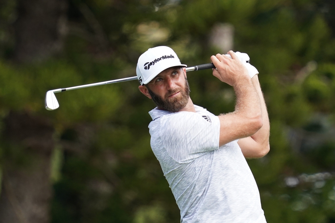 January 7, 2021; Maui, Hawaii, USA; Dustin Johnson hits a tee shot on the second hole during the first round of the Sentry Tournament of Champions golf tournament at Kapalua Resort - The Plantation Course. Mandatory Credit: Kyle Terada-USA TODAY Sports