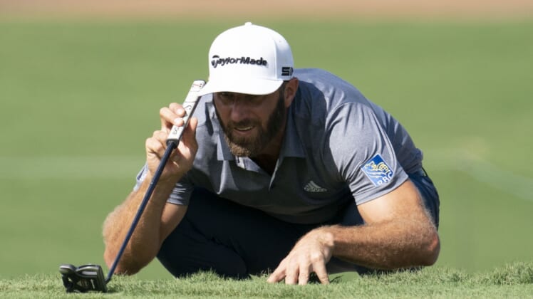 January 9, 2021; Maui, Hawaii, USA; Dustin Johnson lines up his putt on the third hole during the third round of the Sentry Tournament of Champions golf tournament at Kapalua Resort - The Plantation Course. Mandatory Credit: Kyle Terada-USA TODAY Sports