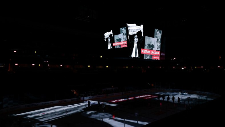 Jan 13, 2021; Denver, Colorado, USA; Former Colorado Avalanche president and general manager Pierre Lacroix is honored on the scoreboard before the game against the St. Louis Blues at Ball Arena. Lacroix died on December 13, 2020 due to complications from COVID-19. Mandatory Credit: Isaiah J. Downing-USA TODAY Sports