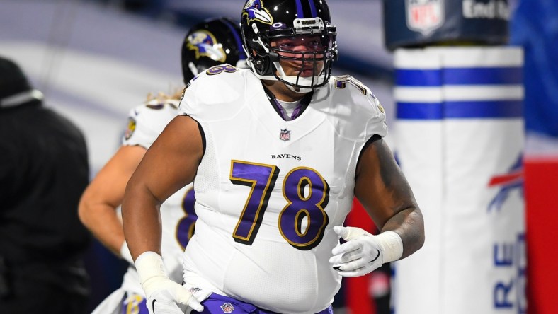 Jan 16, 2021; Orchard Park, New York, USA; Baltimore Ravens offensive tackle Orlando Brown (78) jogs on the field prior to an AFC Divisional Round game against the Buffalo Bills at Bills Stadium. Mandatory Credit: Rich Barnes-USA TODAY Sports