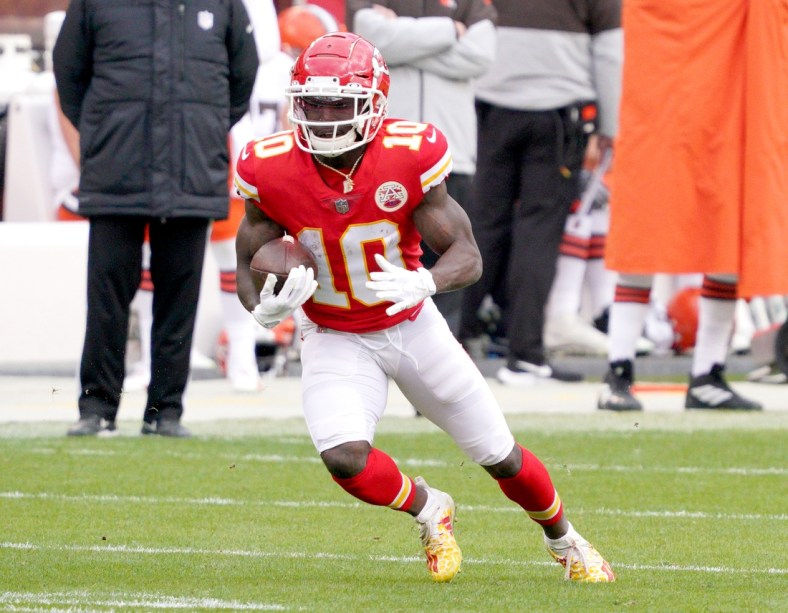 Jan 17, 2021; Kansas City, Missouri, USA; Kansas City Chiefs wide receiver Tyreek Hill (10) runs the ball during the AFC Divisional Round playoff game against the Cleveland Browns at Arrowhead Stadium. Mandatory Credit: Denny Medley-USA TODAY Sports