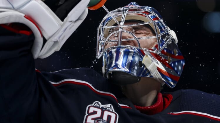 Jan 23, 2021; Columbus, Ohio, USA; Columbus Blue Jackets goaltender Elvis Merzlikins (90) sprays water onto his face prior to the start of the third period against the Tampa Bay Lightning at Nationwide Arena. Mandatory Credit: Aaron Doster-USA TODAY Sports