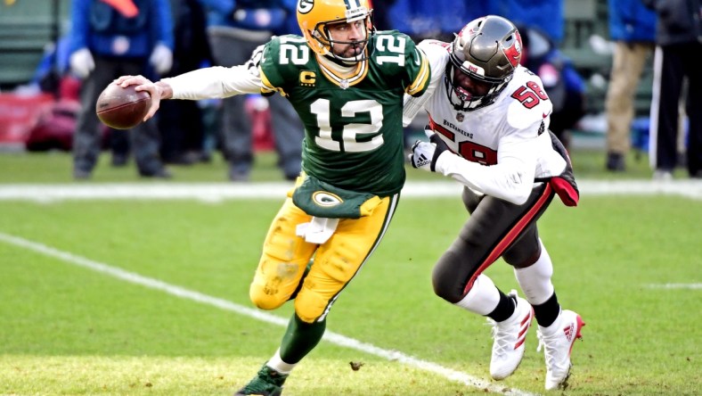 Tampa Bay Buccaneers outside linebacker Jason Pierre-Paul (90) sacks Green Bay Packers quarterback Aaron Rodgers (12) during the first quarter of their NFC Championship game