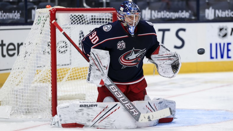 Jan 28, 2021; Columbus, Ohio, USA; Columbus Blue Jackets goaltender Elvis Merzlikins (90) makes a save in net against the Florida Panthers in the second period at Nationwide Arena. Mandatory Credit: Aaron Doster-USA TODAY Sports