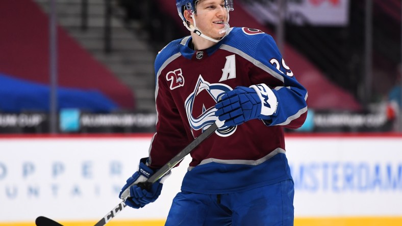 Jan 28, 2021; Denver, Colorado, USA; Colorado Avalanche center Nathan MacKinnon (29) reacts during the third period against the San Jose Sharks at Ball Arena. Mandatory Credit: Ron Chenoy-USA TODAY Sports