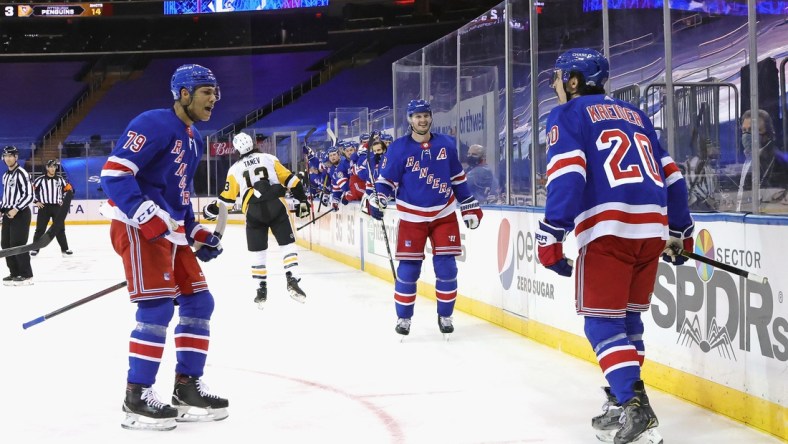 Jan 30, 2021; New York, New York, USA;(l-r) K'Andre Miller #79, Jacob Trouba #8 and Chris Kreider #20 of the New York Rangers celebrate Kreider's second period goal against the Pittsburgh Penguins at Madison Square Garden on January 30, 2021 in New York City. Mandatory Credit: Bruce Bennett/POOL PHOTOS-USA TODAY Sports