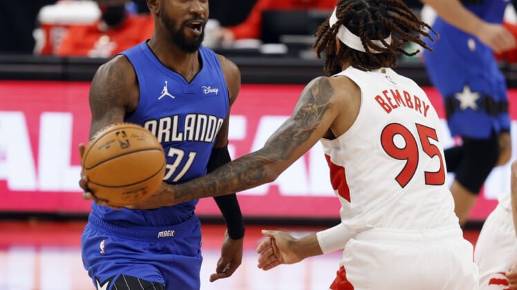Jan 31, 2021; Tampa, Florida, USA; Orlando Magic guard Terrence Ross (31) drives to the basket as he is fouled by Toronto Raptors forward DeAndre' Bembry (95) during the second half at Amalie Arena. Mandatory Credit: Kim Klement-USA TODAY Sports