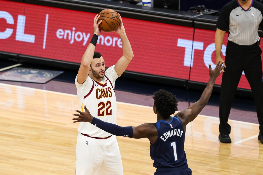 Jan 31, 2021; Minneapolis, Minnesota, USA; Cleveland Cavaliers forward Larry Nance Jr. (22) controls the ball against Minnesota Timberwolves guard Anthony Edwards (1) in the third quarter at Target Center. Mandatory Credit: David Berding-USA TODAY Sports