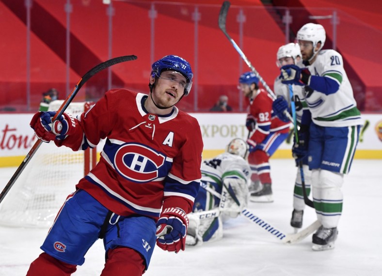 Feb 1, 2021; Montreal, Quebec, CAN; Montreal Canadiens forward Brendan Gallagher (11) reacts after scoring a goal against Vancouver Canucks goalie Braden Holtby (49) during the second period at the Bell Centre. Mandatory Credit: Eric Bolte-USA TODAY Sports