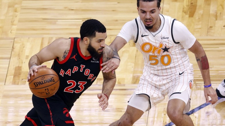 Feb 2, 2021; Orlando, Florida, USA; Toronto Raptors guard Fred VanVleet (23) drives to the basket as Orlando Magic guard Cole Anthony (50) defends during the first quarter at Amway Center. Mandatory Credit: Kim Klement-USA TODAY Sports