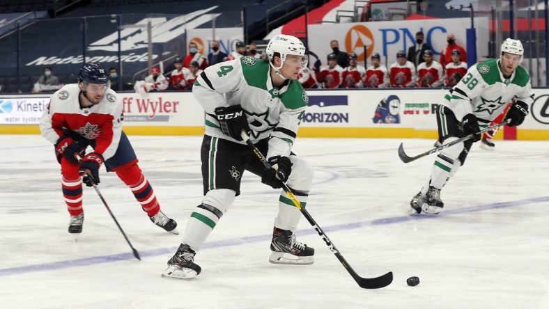 Feb 2, 2021; Columbus, Ohio, USA; Dallas Stars defenseman Miro Heiskanen (4) passes the puck against the Columbus Blue Jackets during the second period at Nationwide Arena. Mandatory Credit: Russell LaBounty-USA TODAY Sports