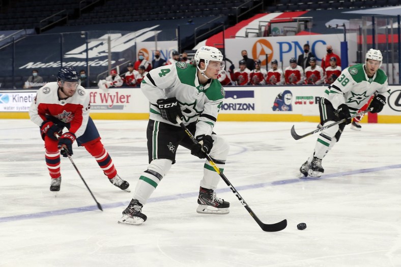 Feb 2, 2021; Columbus, Ohio, USA; Dallas Stars defenseman Miro Heiskanen (4) passes the puck against the Columbus Blue Jackets during the second period at Nationwide Arena. Mandatory Credit: Russell LaBounty-USA TODAY Sports