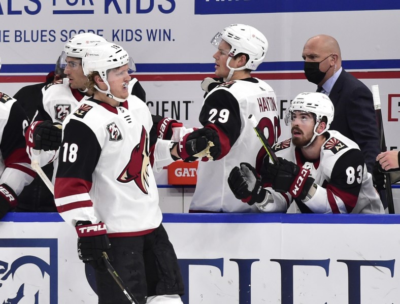 Feb 2, 2021; St. Louis, Missouri, USA;  Arizona Coyotes center Christian Dvorak (18) is congratulated by center Barrett Hayton (29) and right wing Conor Garland (83) after scoring during the first period against the St. Louis Blues at Enterprise Center. Mandatory Credit: Jeff Curry-USA TODAY Sports