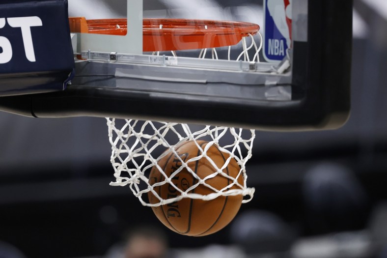 Feb 2, 2021; Salt Lake City, Utah, USA; The ball drops through the hoop during a team warm up period prior to the Utah Jazz against the Detroit Pistons at Vivint Smart Home Arena. Mandatory Credit: Jeffrey Swinger-USA TODAY Sports