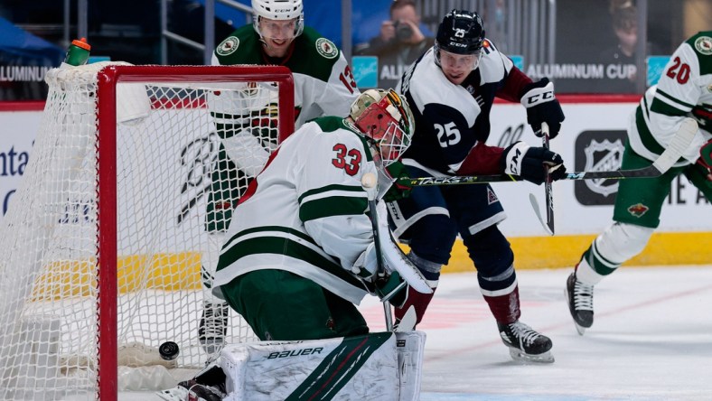 Feb 2, 2021; Denver, Colorado, USA; Colorado Avalanche right wing Logan O'Connor (25) scores past Minnesota Wild goaltender Cam Talbot (33) as center Nick Bonino (13) defends in the first period at Ball Arena. Mandatory Credit: Isaiah J. Downing-USA TODAY Sports