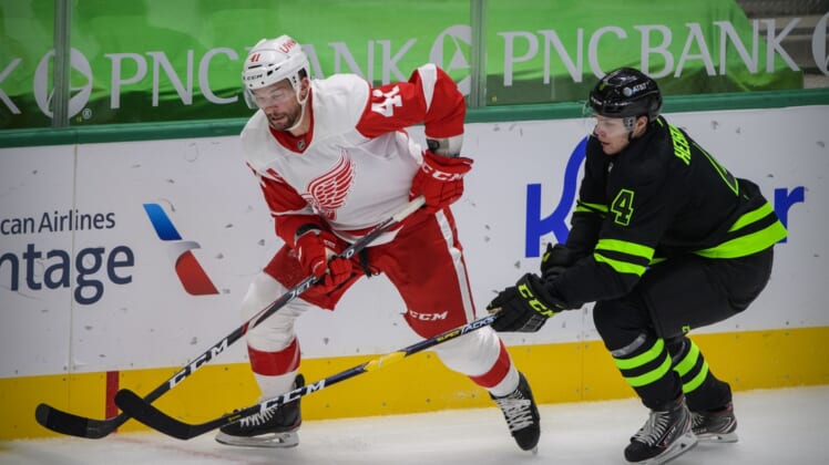 Jan 28, 2021; Dallas, Texas, USA; Detroit Red Wings center Luke Glendening (41) and Dallas Stars defenseman Miro Heiskanen (4) in action during the game between the Dallas Stars and the Detroit Red Wings at the American Airlines Center. Mandatory Credit: Jerome Miron-USA TODAY Sports